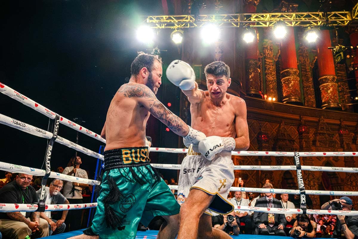 Jonny Mansour throws a punch during his bout against Ernest Bustos