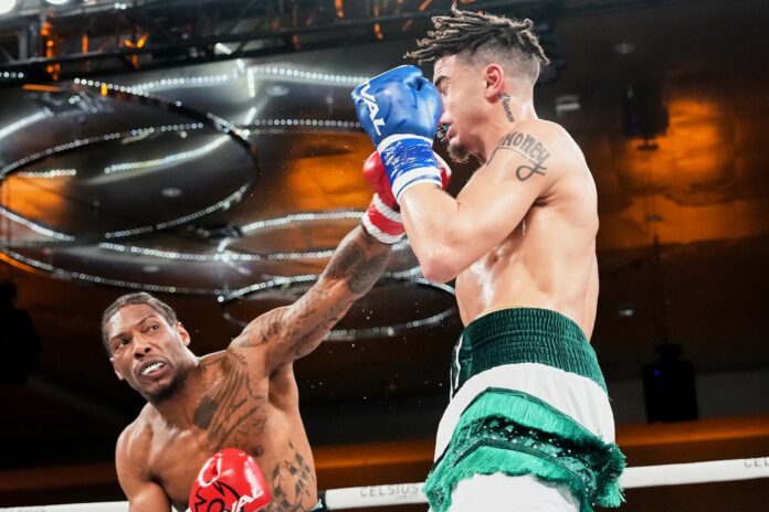 Kahlil Mitchell throws a punch during his bout against Jamar Pemberton