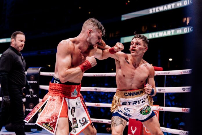 Kai Stewart lands a punch during his bout against Harry Gigliotti