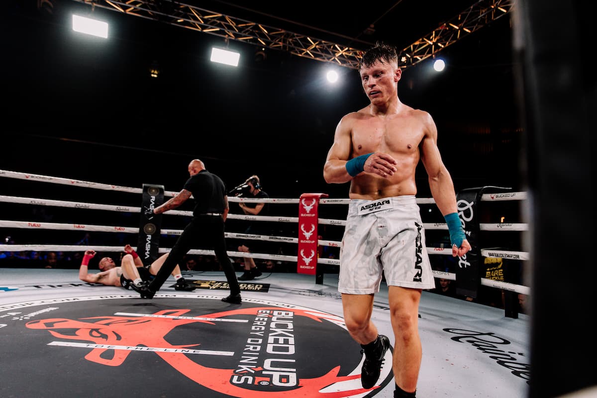 Lewis Keen knocks down Stew Martin during their bout