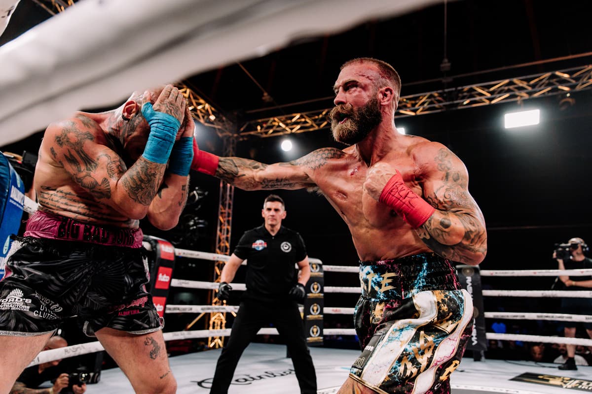 Mickey Nolan lands a punch during his bout against John Ferguson