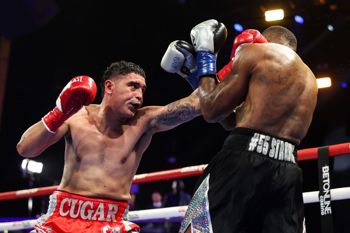 Raul Curiel throws a jab during his bout against Quinton Randall