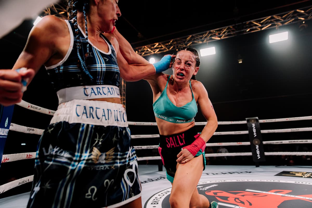 Sally Macdonald lands a punch during her bout against Sandra Rees