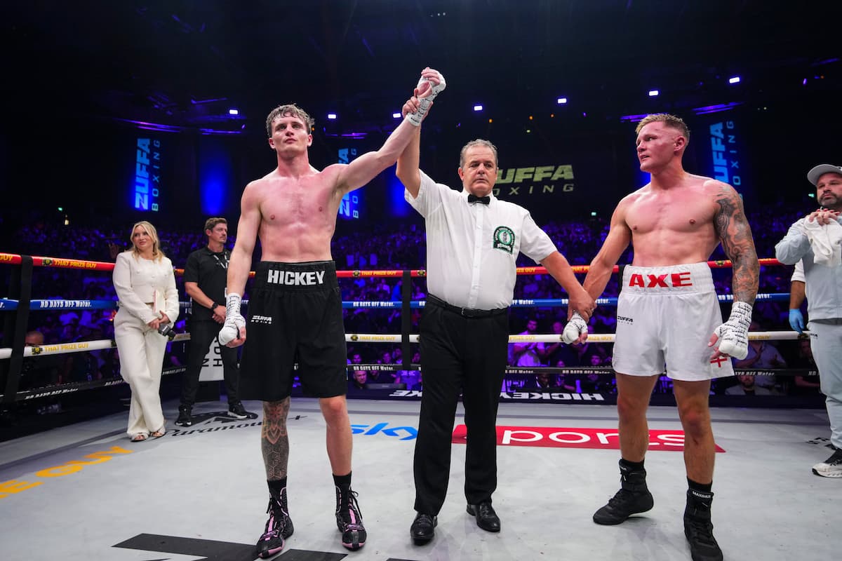 Sam Hickey has his hand raised by the referee after his victory over Brad Axe