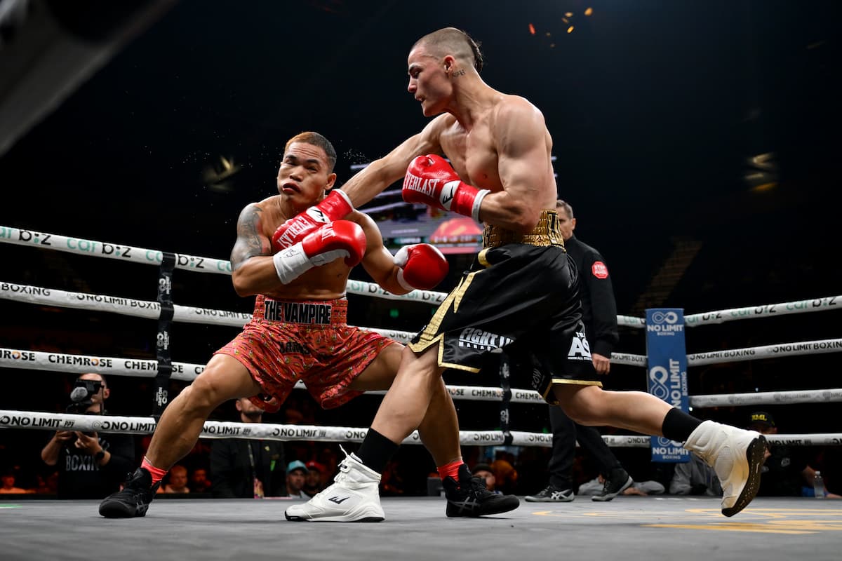 Vegas Larfield lands a punch during his bout against Jubert Buhat