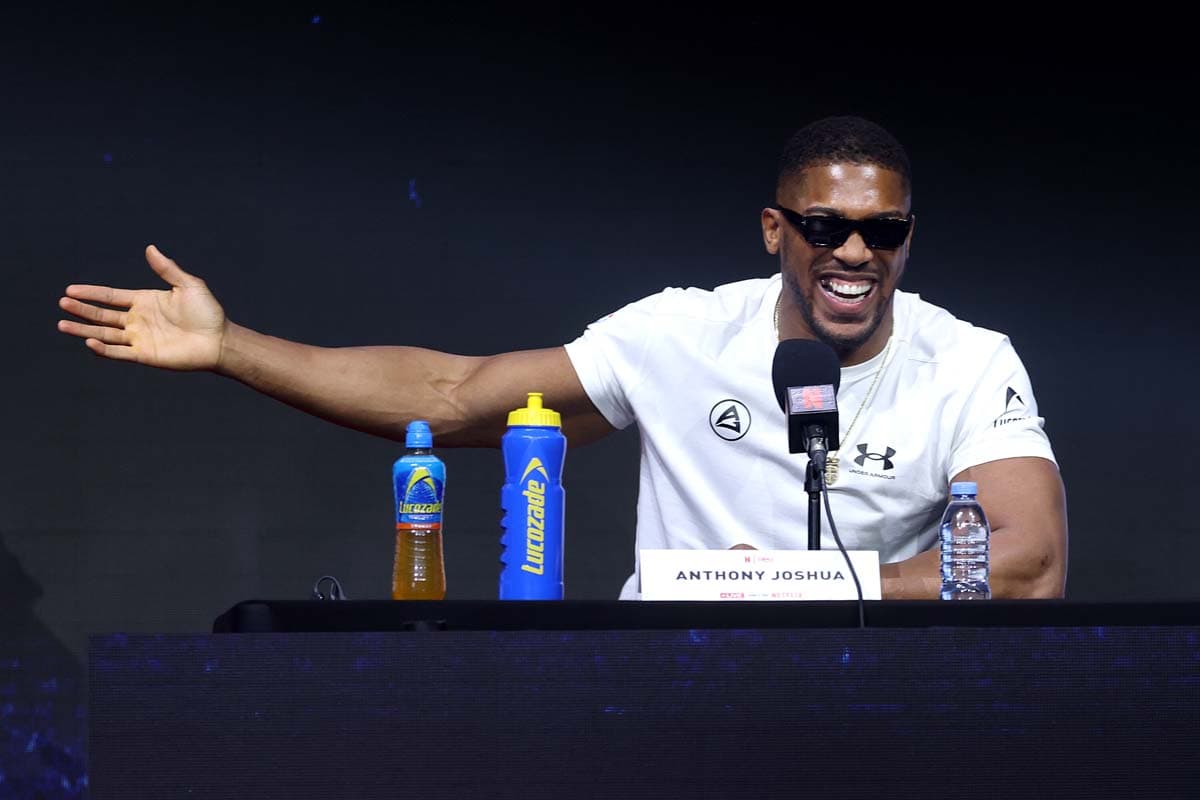 Anthony Joshua laughs during the press conference in London