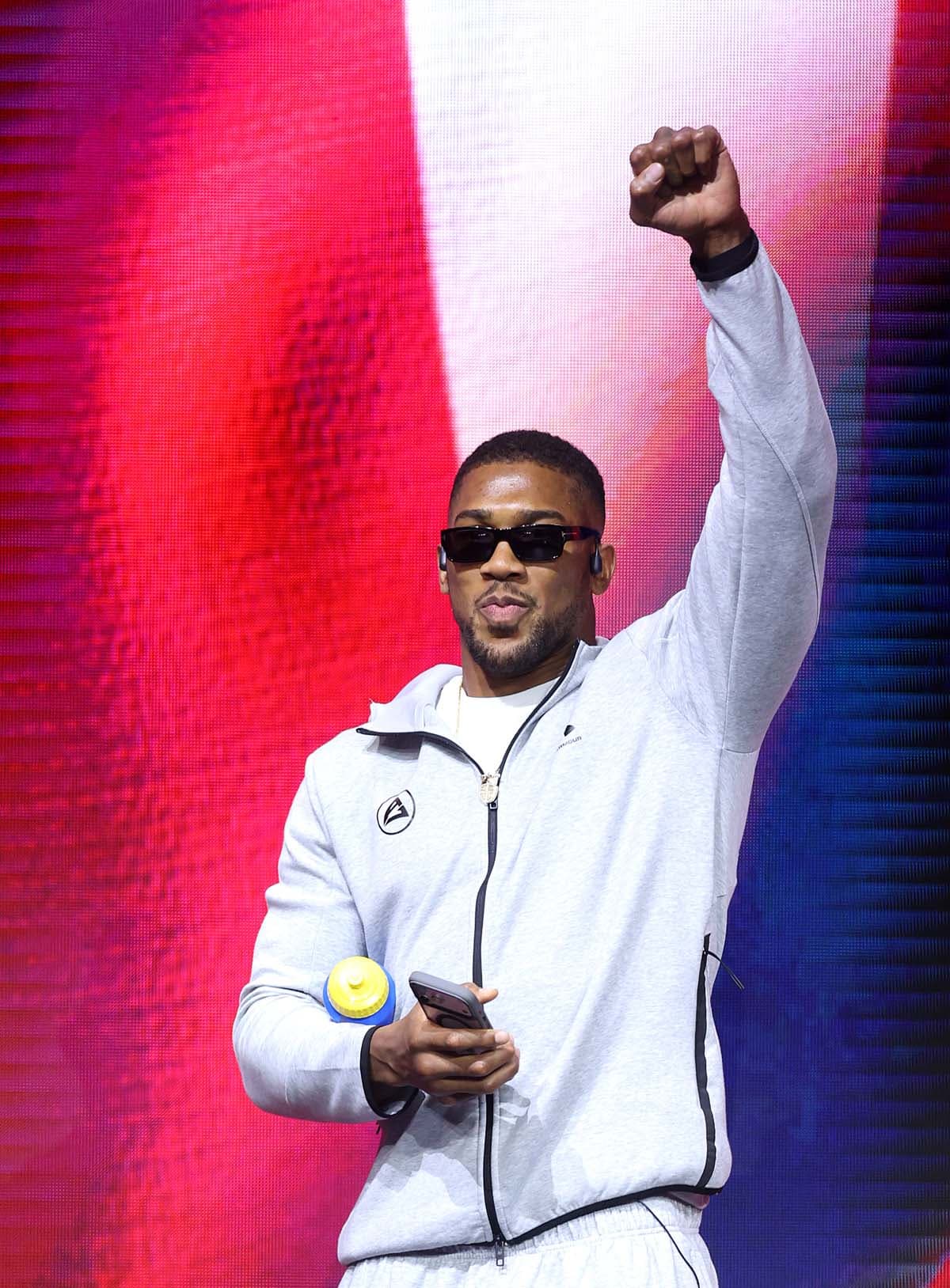 Anthony Joshua walks out at the press conference in London
