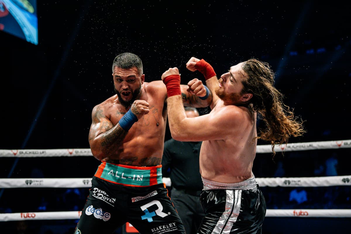 Chino Blume throws a hook during his bout against Caleb Joseph Avila