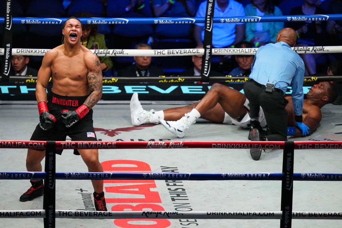 Da'Mazion Vanhouter celebrates his victory as Raphael Akpejiori lies on the canvas