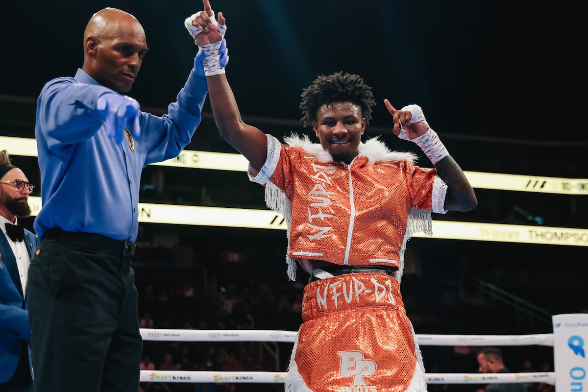 Dennis Thompson has his hand raised by the referee after his victory over Jose Casillas