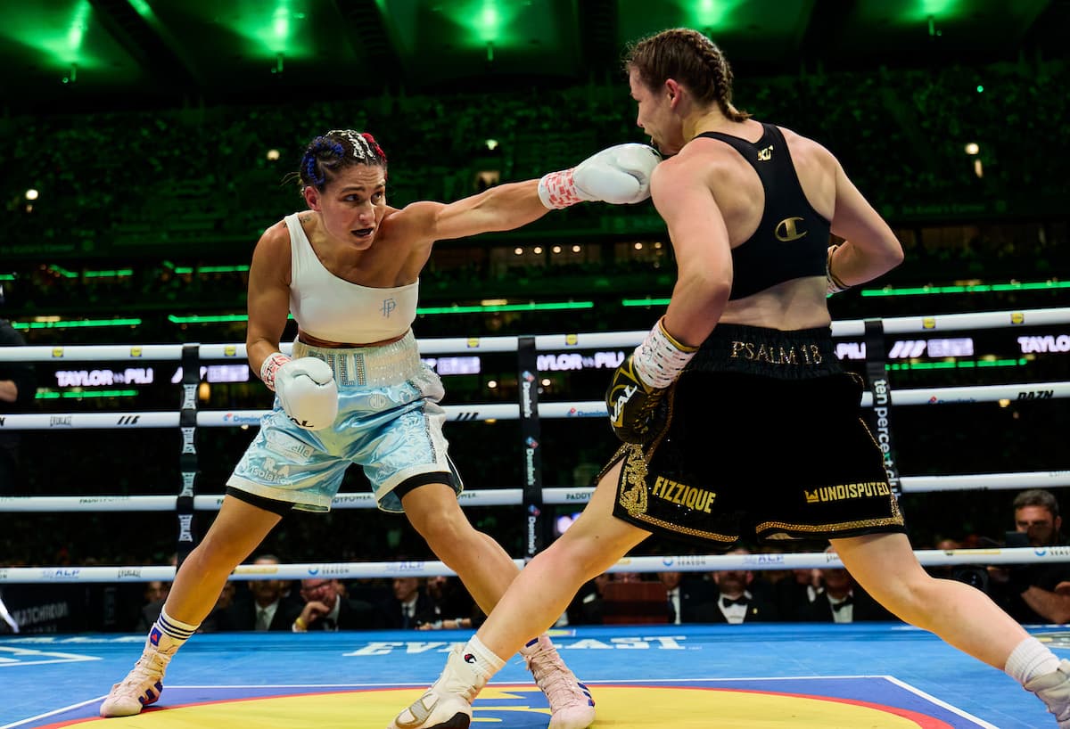 Flora Pili throws a jab during her bout against Katie Taylor