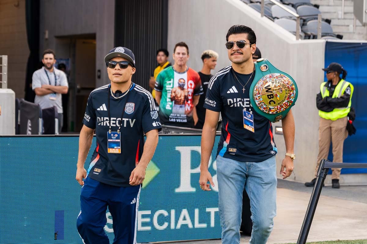 Isaac Cruz and Jesus Ramos walk out onto the field at Snapdragon Stadium