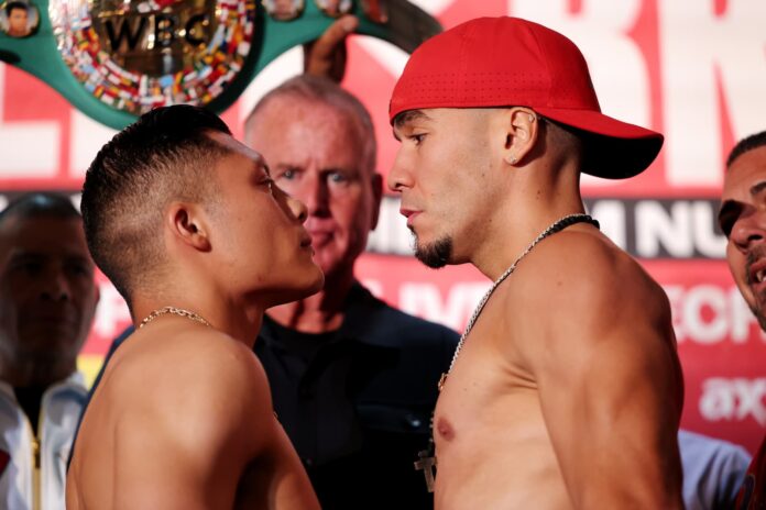 Isaac Cruz and Nestor Bravo face off during the weigh-in ahead of their bout in San Diego