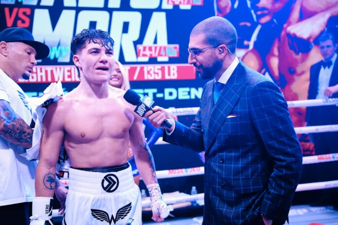 Javon Walton speaks with Ariel Helwani during a post-fight interview after his bout against Anthony Mora