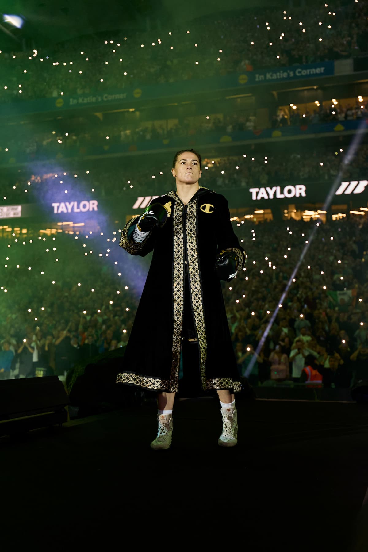 Katie Taylor makes her ring walk ahead of her bout against Flora Pili