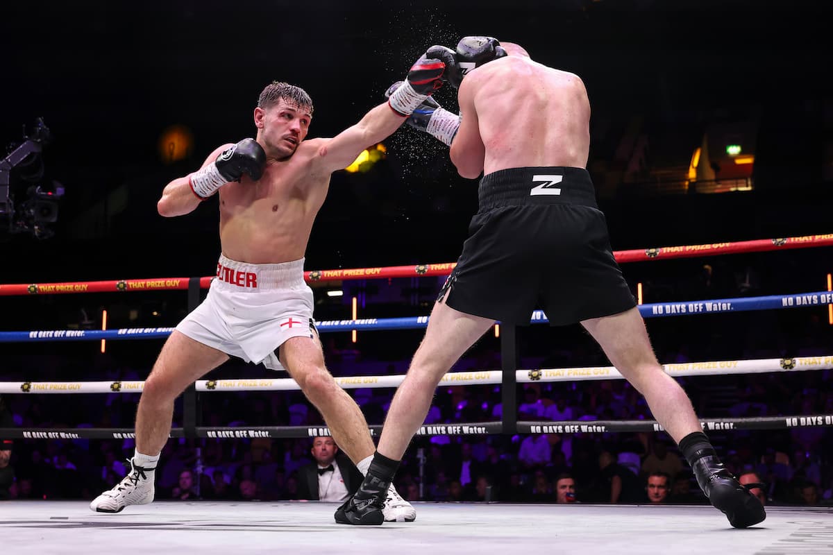Alt text: Lee Cutler lands a jab during his bout against Louis Greene