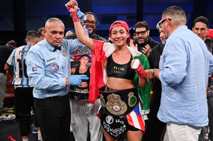 Litzy Vazquez Ochoa has her hand raised in victory over Edith Soledad Matthysse