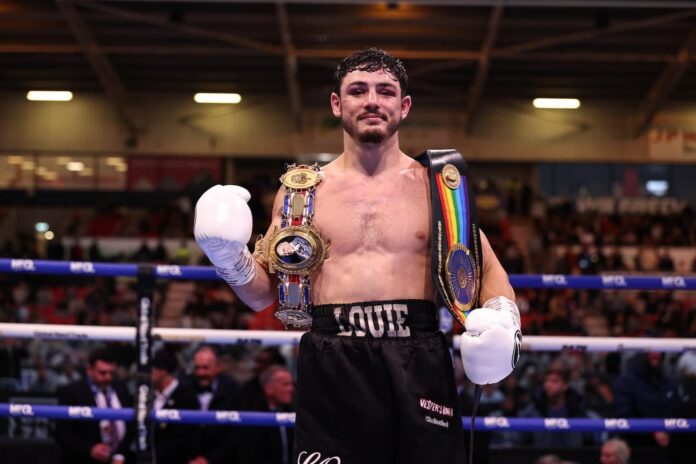 Louie O'Doherty poses with his championship belt after his victory over Ahmed Hatim