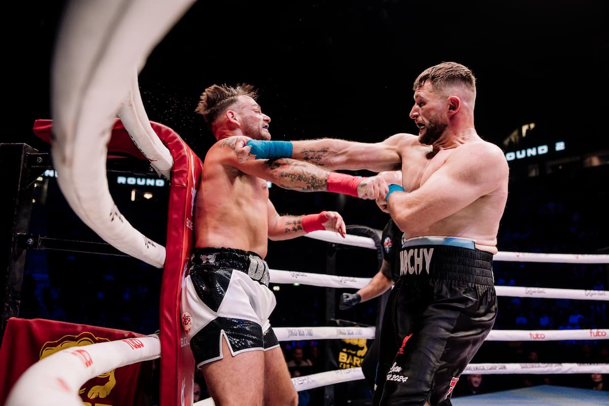 Luke Bassnett lands a punch during his bout against Darren Willans