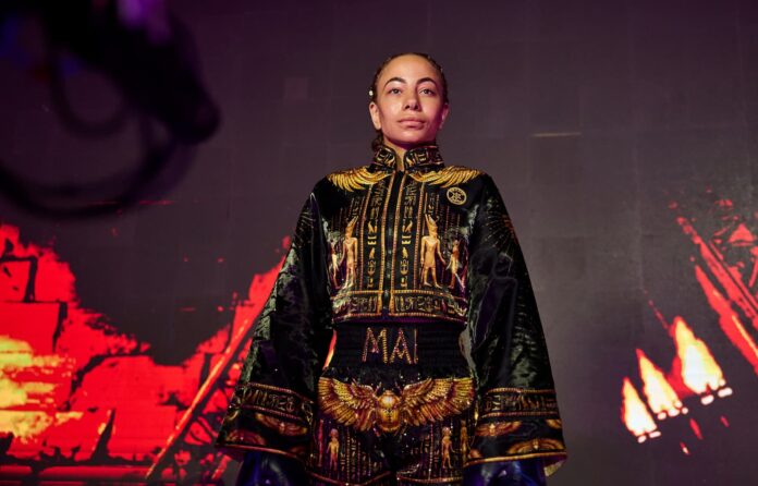 Mai Soliman makes her ring walk during her bout against Mizuki Hiruta