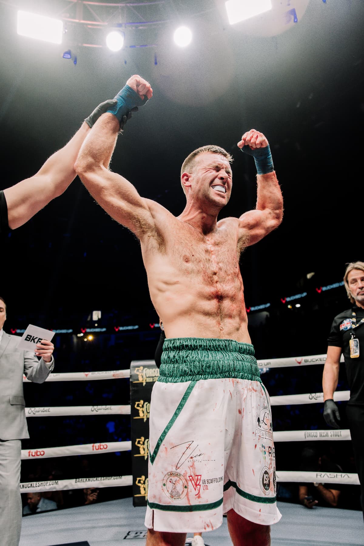 Mikey Henderson has his hand raised in victory after defeating Matthew Wiwczaryk