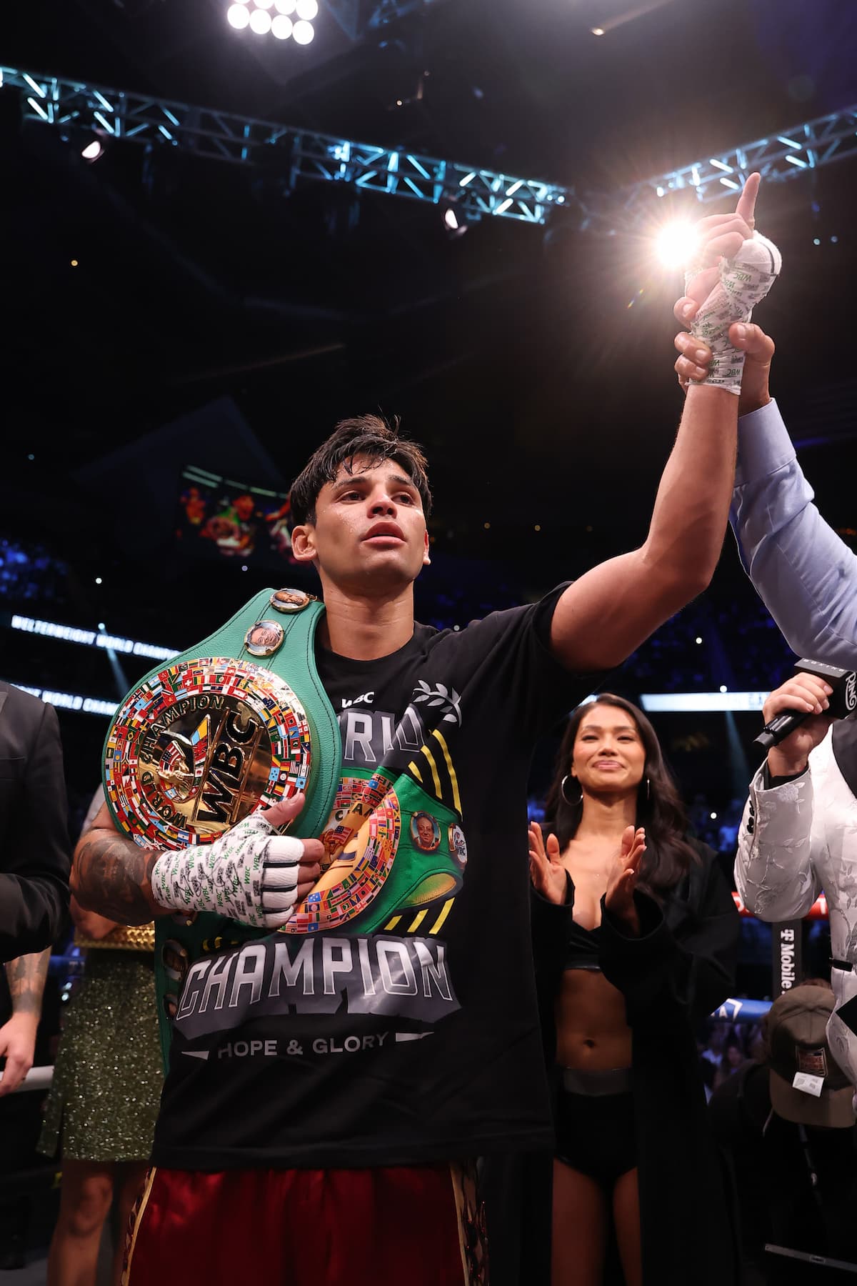 Ryan Garcia has his hand raised by referee Thomas Taylor in victory over Conor Benn