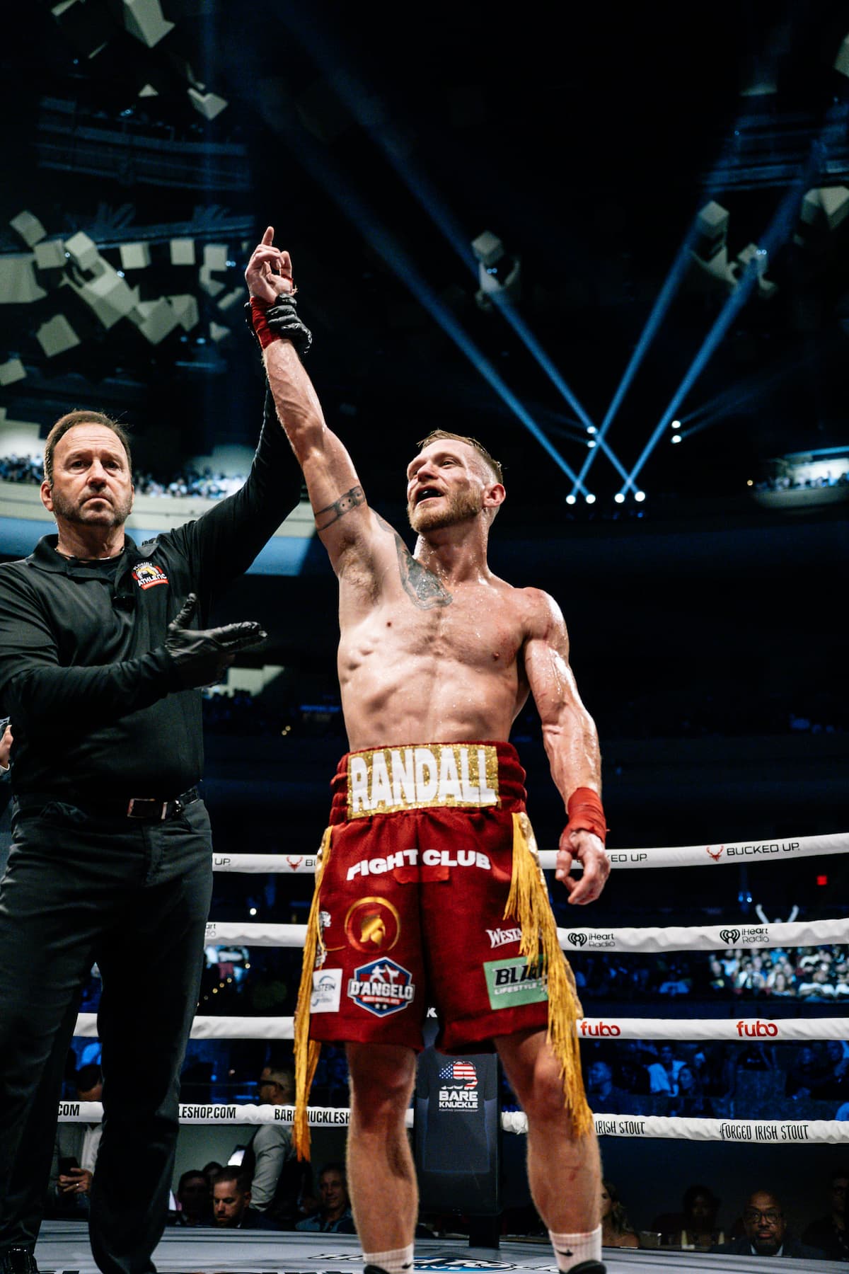 Tyler Randall has his hand raised by the referee after his victory over Chris Garcia