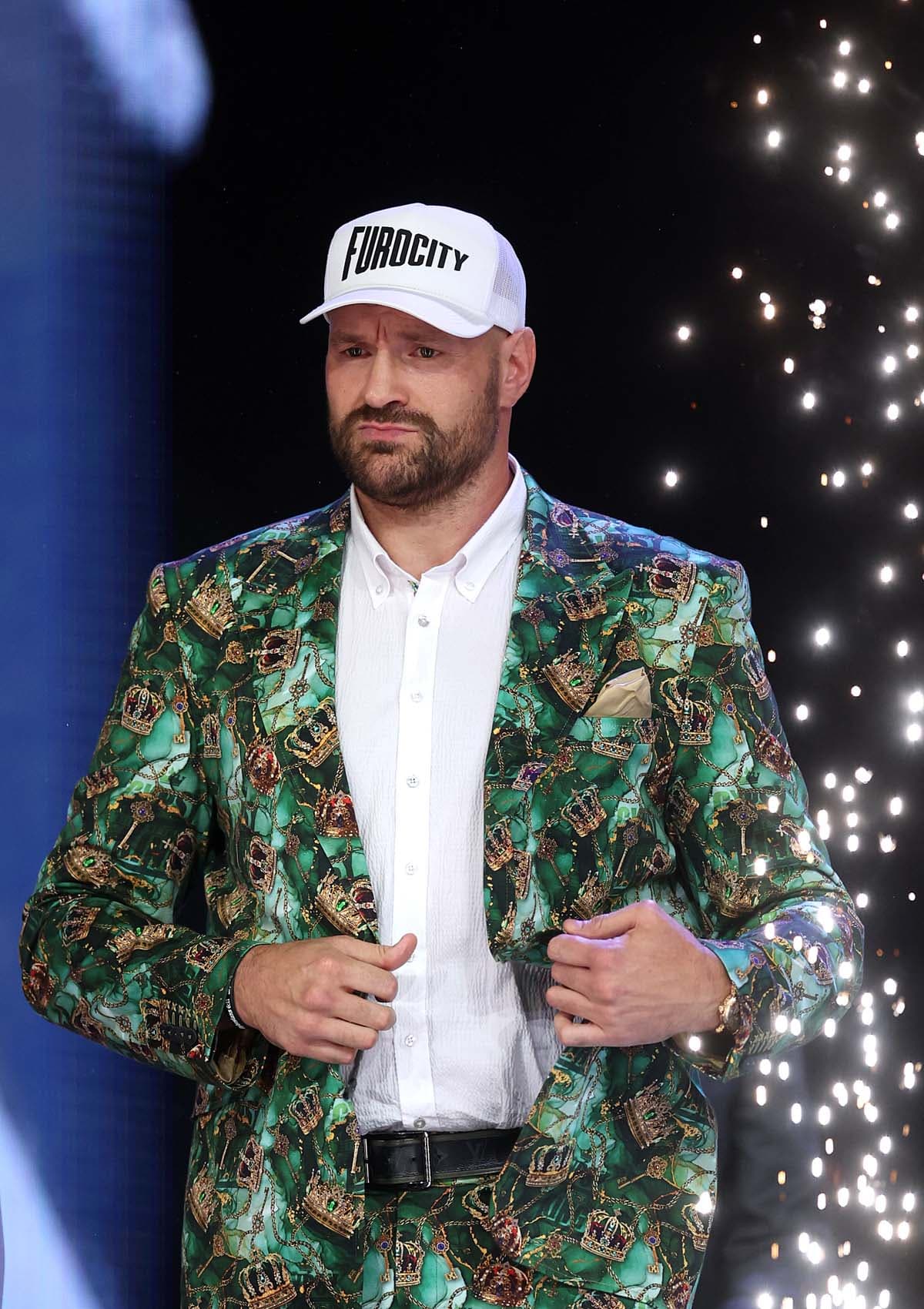 Tyson Fury walks out at the press conference in London