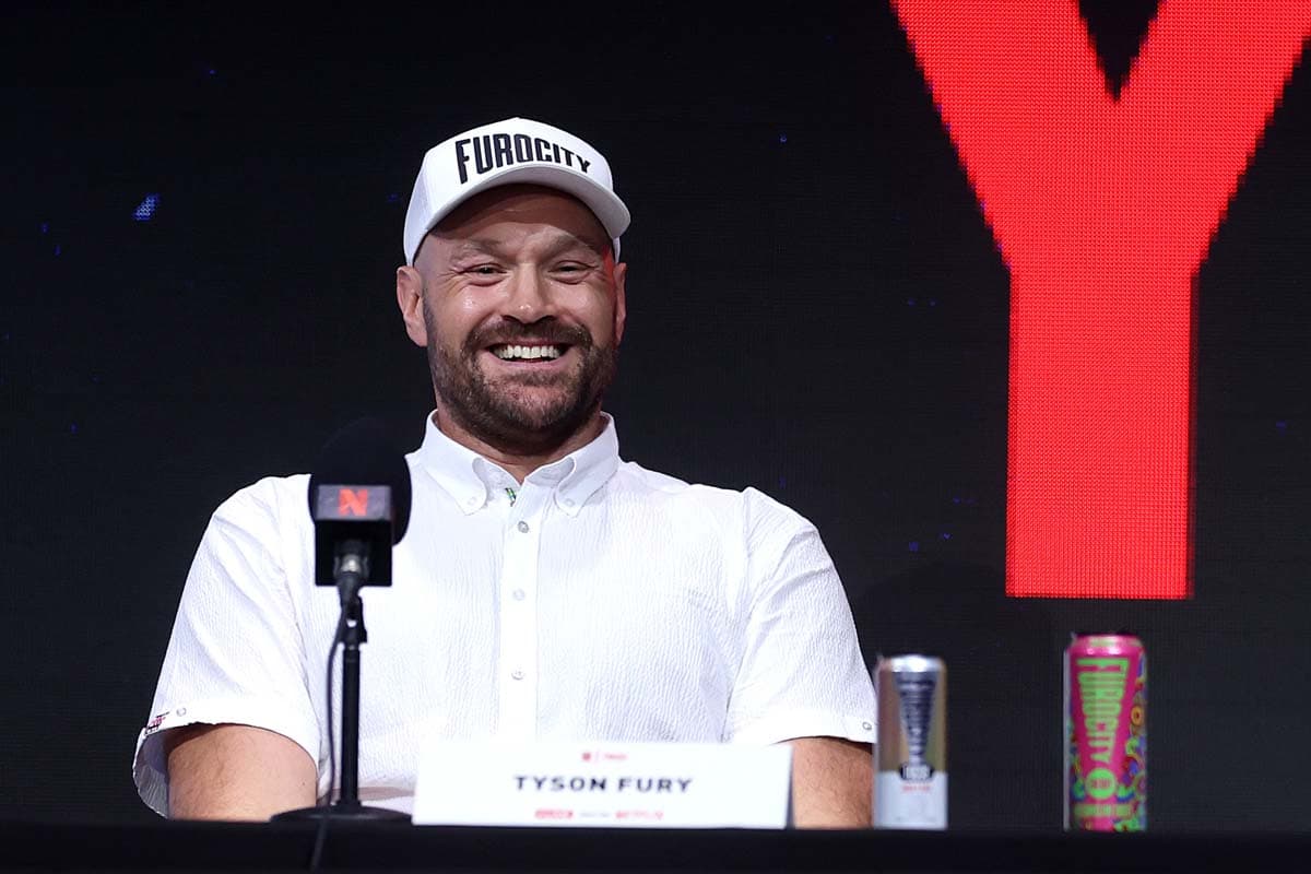 Tyson Fury smiles during the press conference in London
