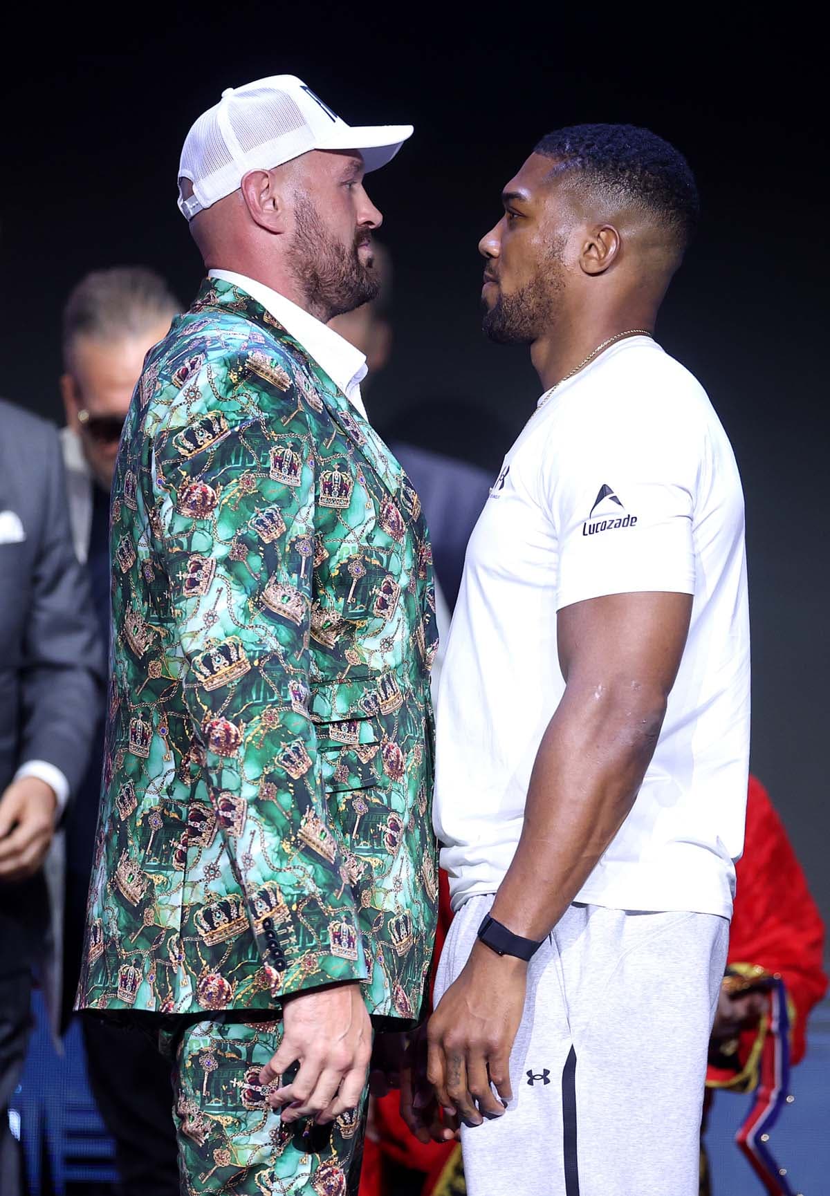 Tyson Fury and Anthony Joshua face off during the press conference in London