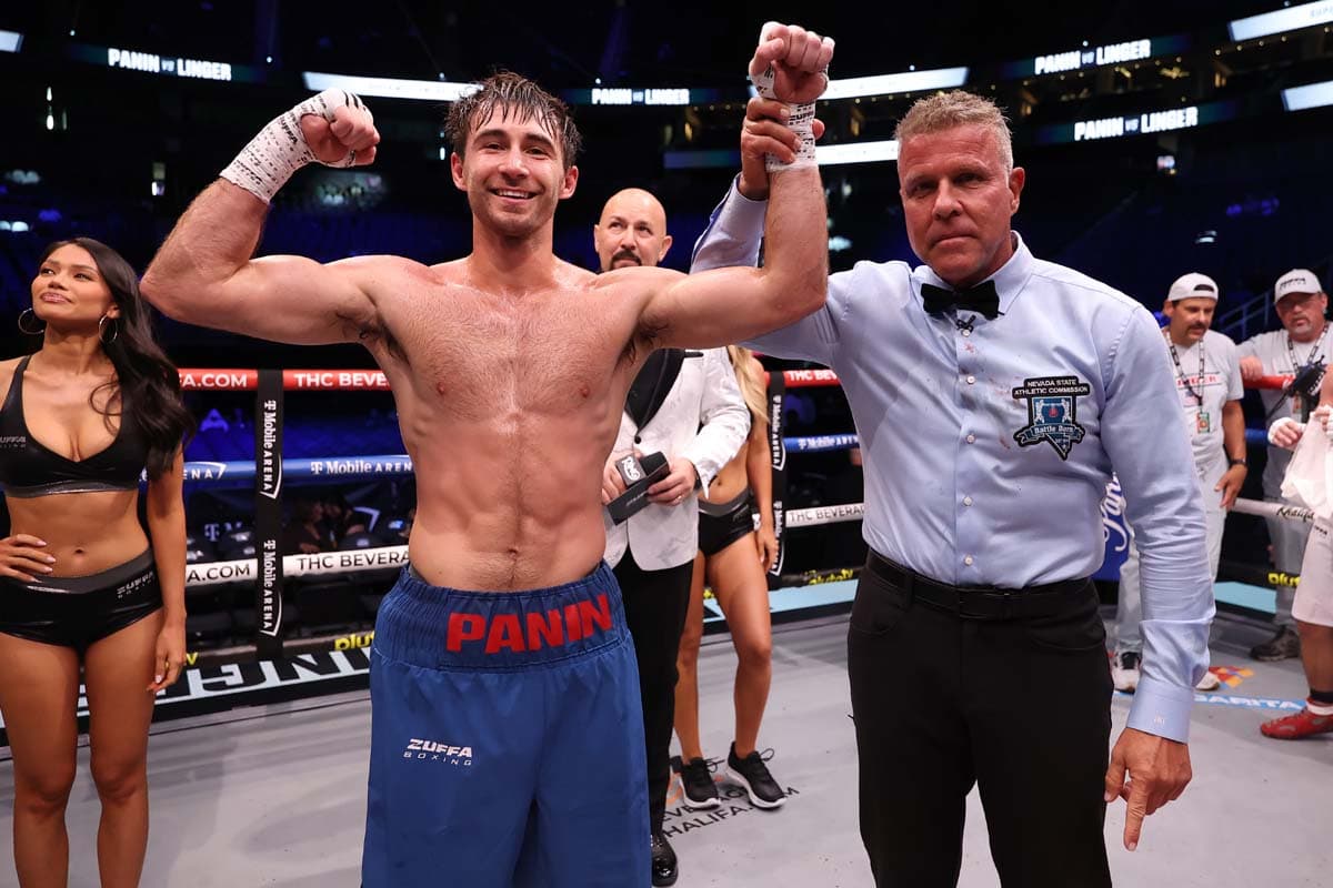 Vlad Panin has his hand raised by referee Thomas Taylor after his victory over Dakota Linger