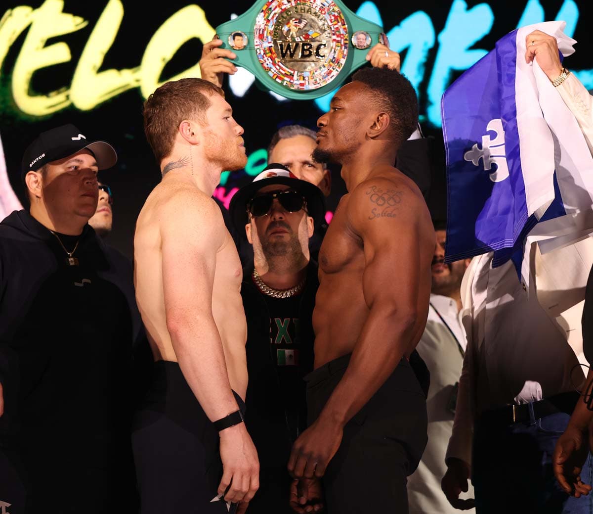 Canelo Alvarez and Christian Mbilli face off during the weigh-in