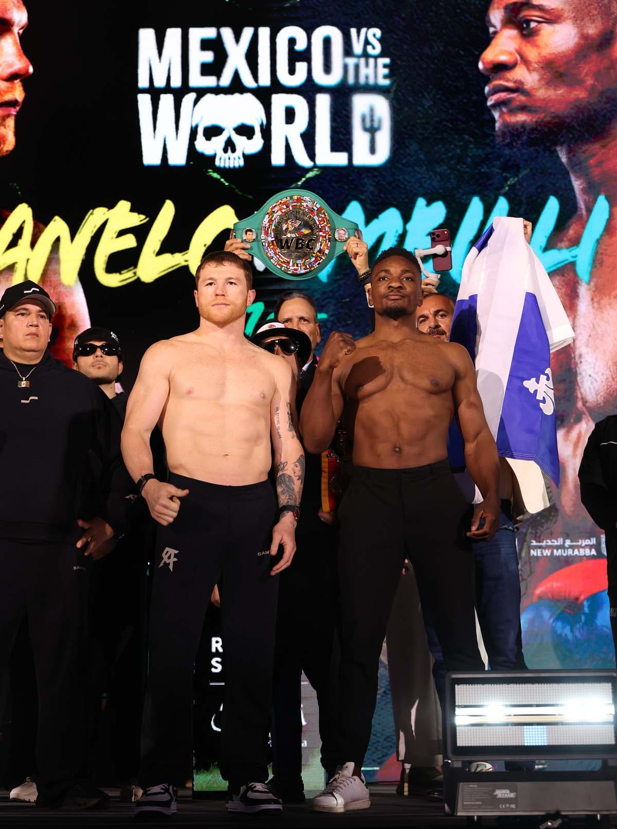 Canelo Alvarez and Christian Mbilli during the weigh-in