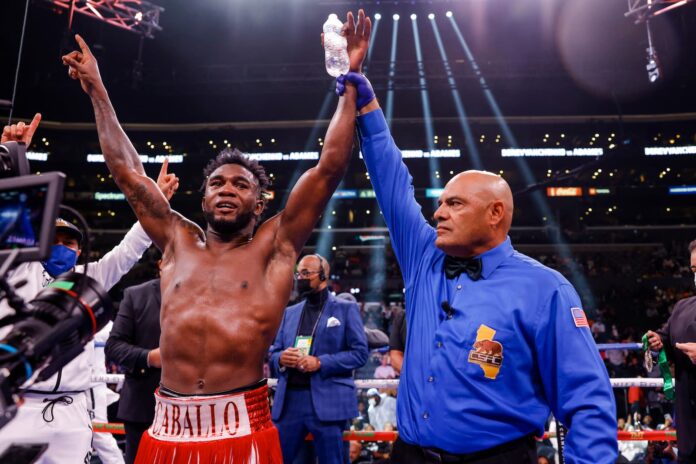 Carlos Adames has his hand raised by the referee in victory over Sergiy Derevyanchenko