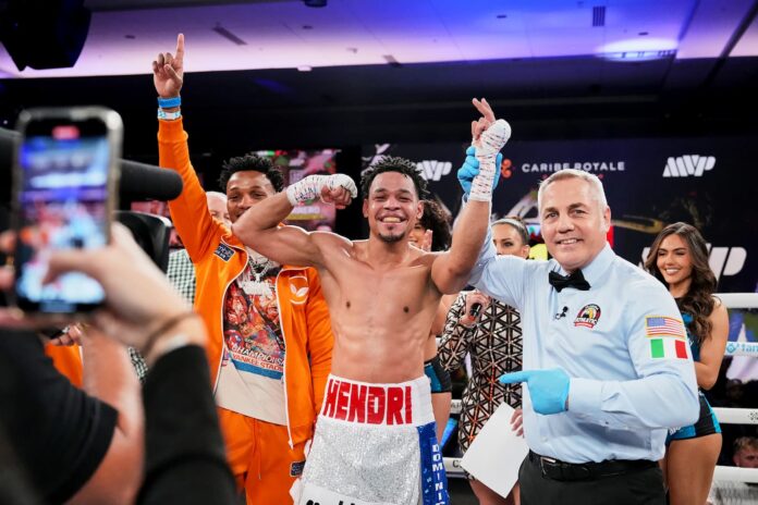 Hendri Cedeno has his hand raised by the referee in victory over Luis Hernandez Ramos