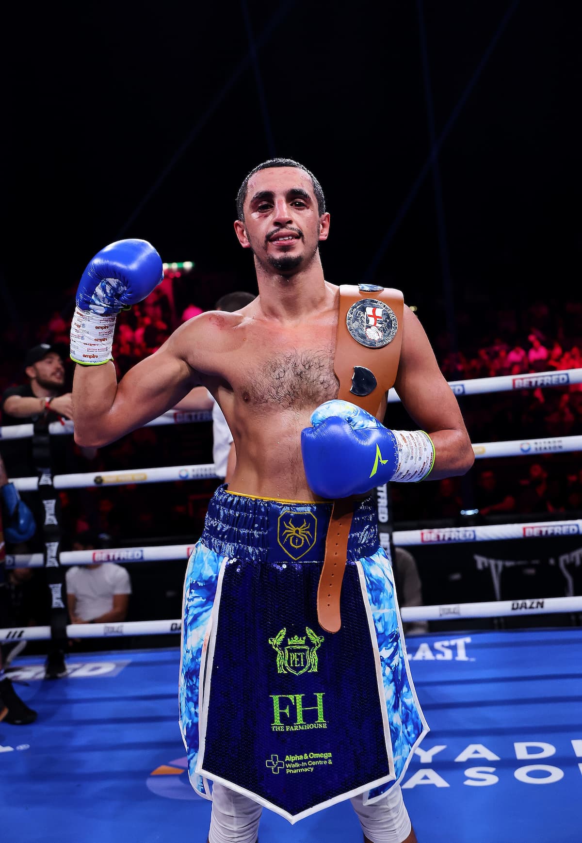 Ibraheem Sulaimaan poses with his championship belt