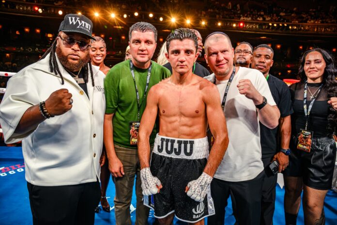 Julius Ballo in the ring with his team following his victory over Julian Gomez-Clemons