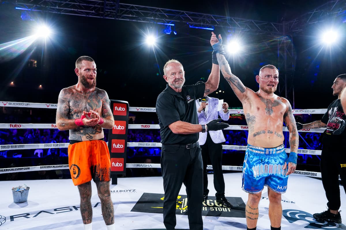 Mick Whitehead has his hand raised by the referee in victory over Ryan Winnett