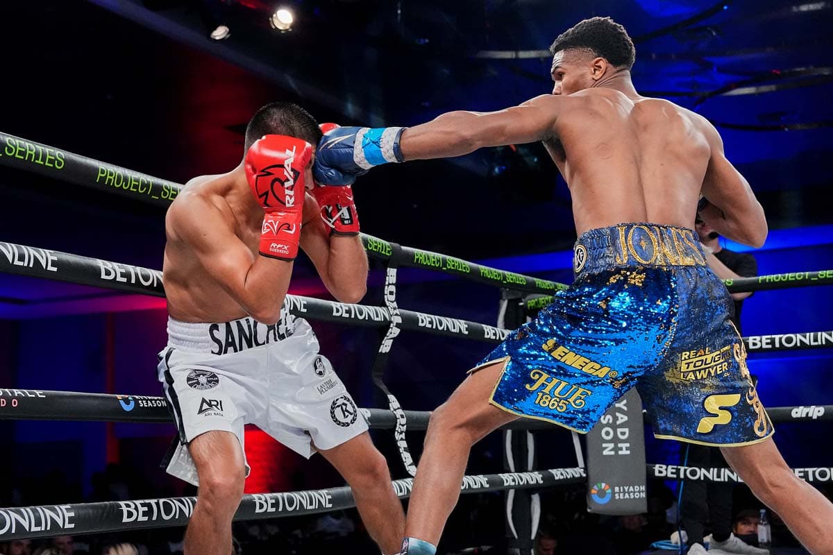 Omari Jones lands a jab on Alan Sanchez during their bout