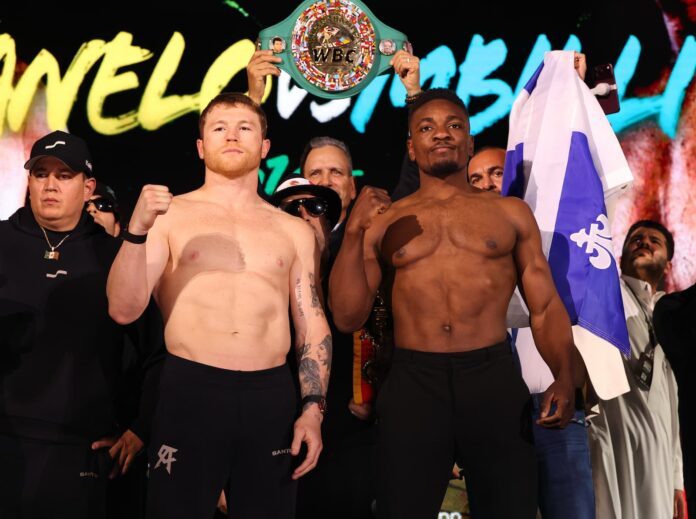 Canelo Alvarez and Christian Mbilli during the weigh-in